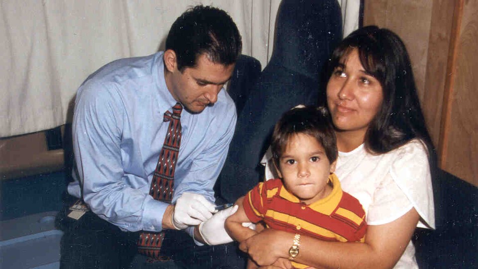 Girl being vaccinated