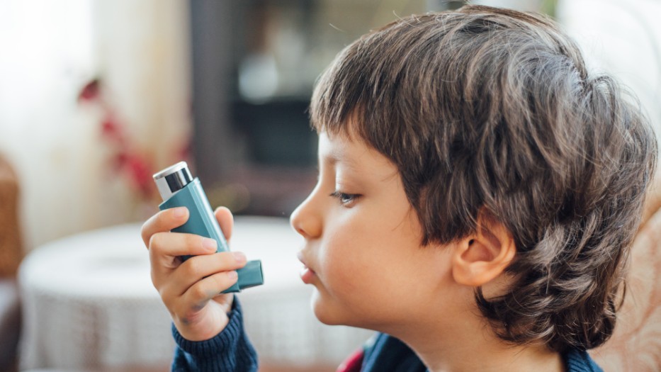 Boy with asthma inhaler