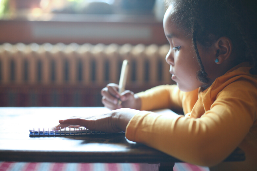 Little girl writing